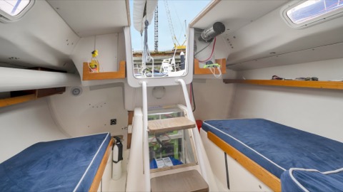 Photo of the Pegasus Racing J-E100 — Companionway steps and easy to access electric sail drive batteries